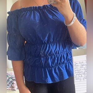 Dark blue, off the shoulder top.